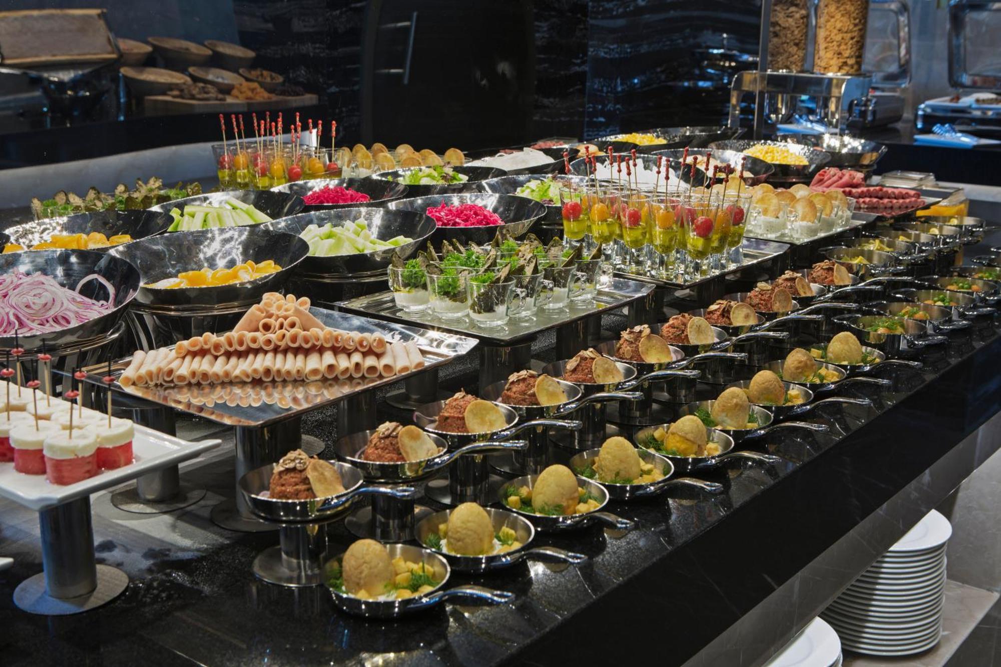 Doubletree By Hilton Istanbul - Piyalepasa Hotel Exterior photo A buffet of canapés